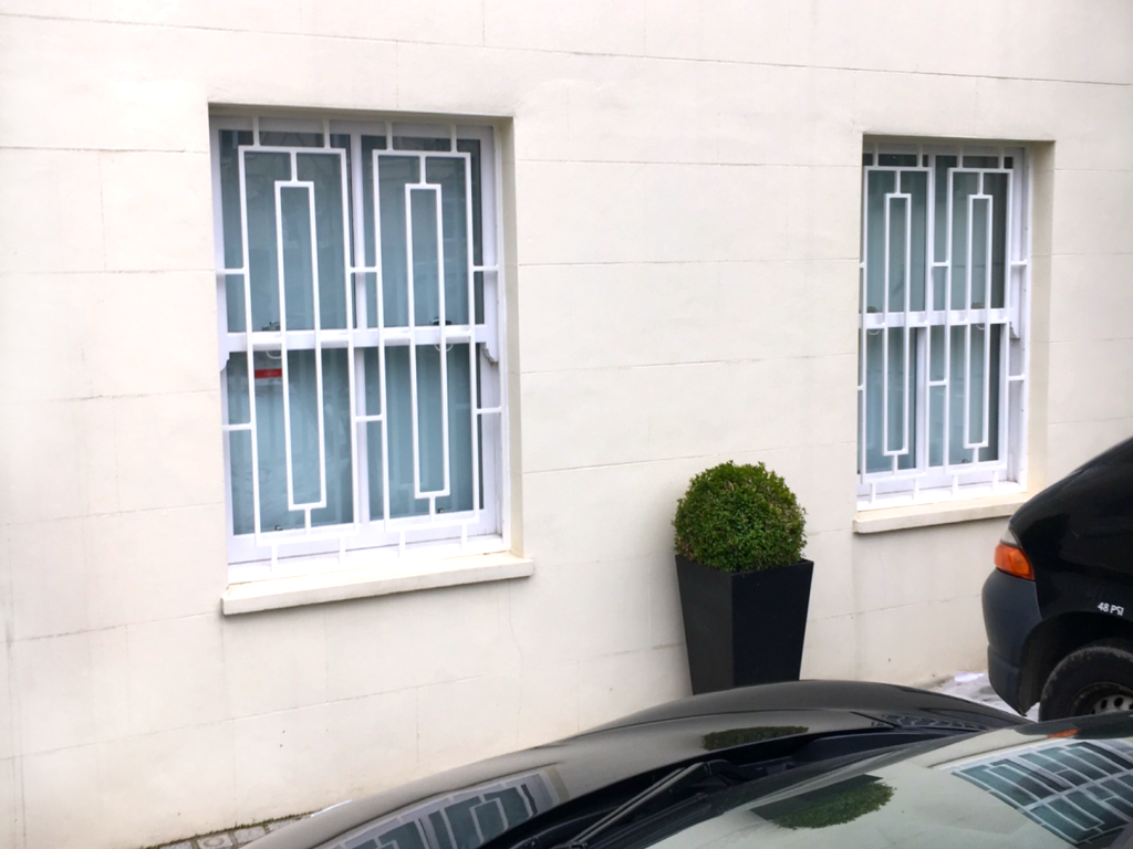 Windows with bar railings in St Johns Wood London
